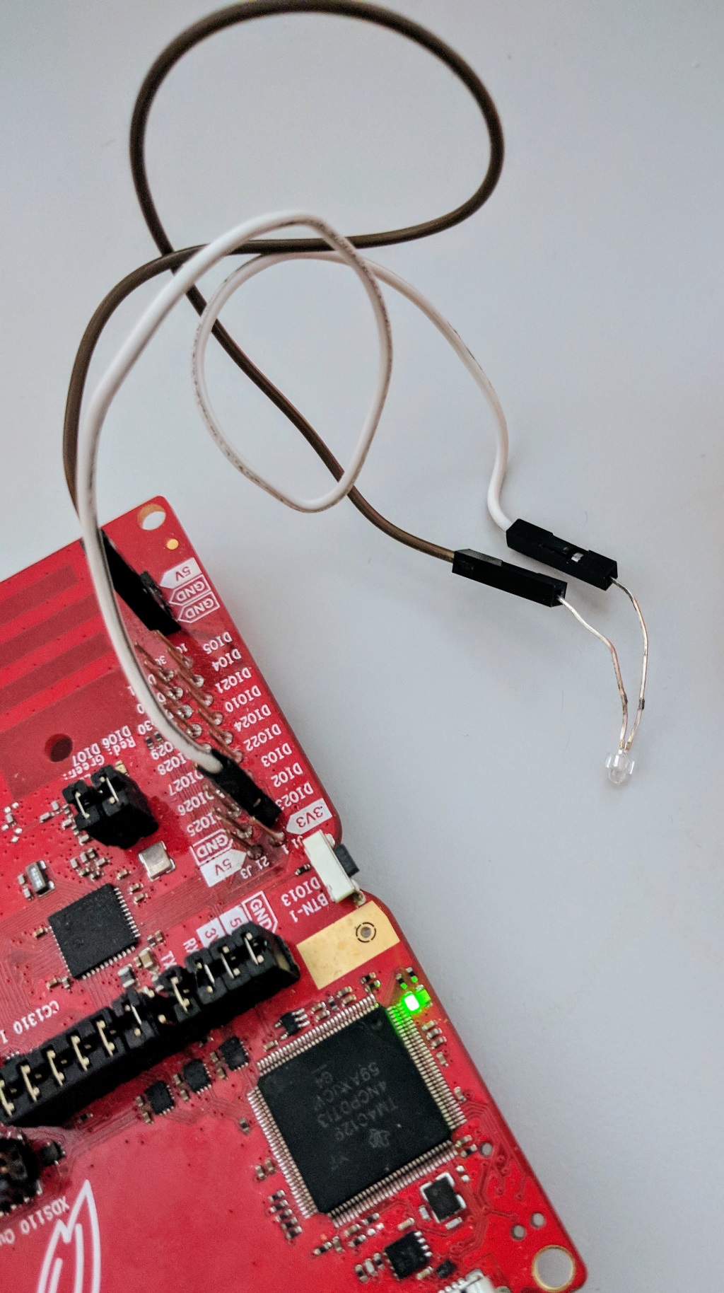 A CC1310/CC1350 Texas Instruments Launchpad board controlling an LED