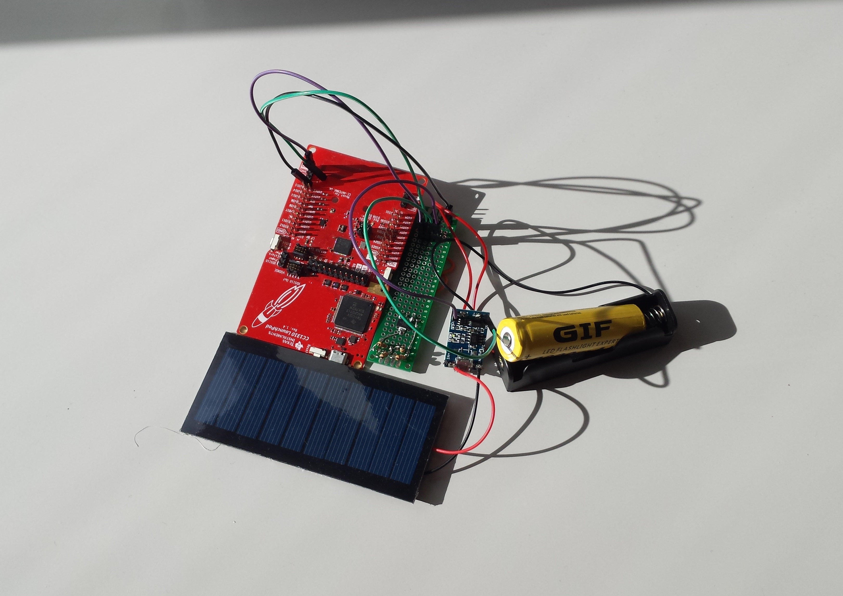 IoT prototype hardware that consists of a solar cell, one rechargeable battery, and one wireless TI Launchpad device